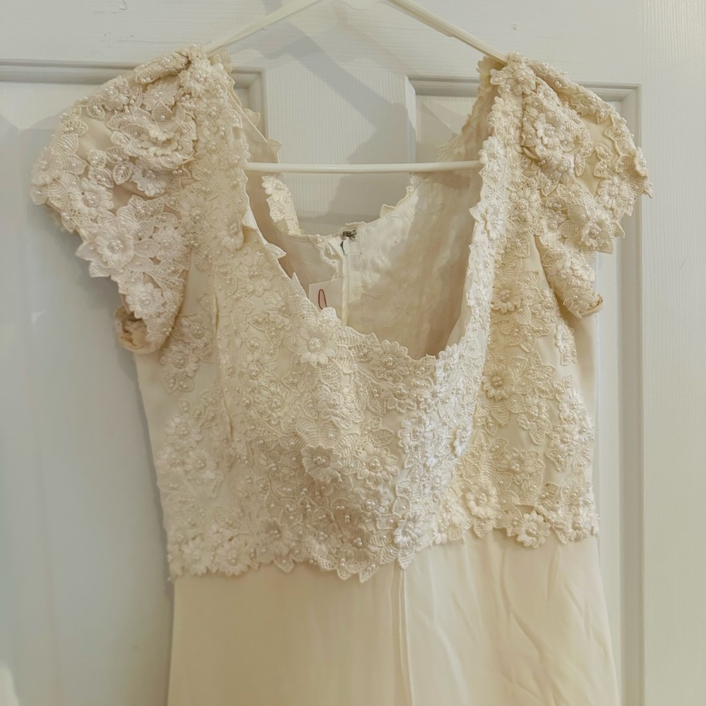 Mon Cheri silk wedding dress never worn.